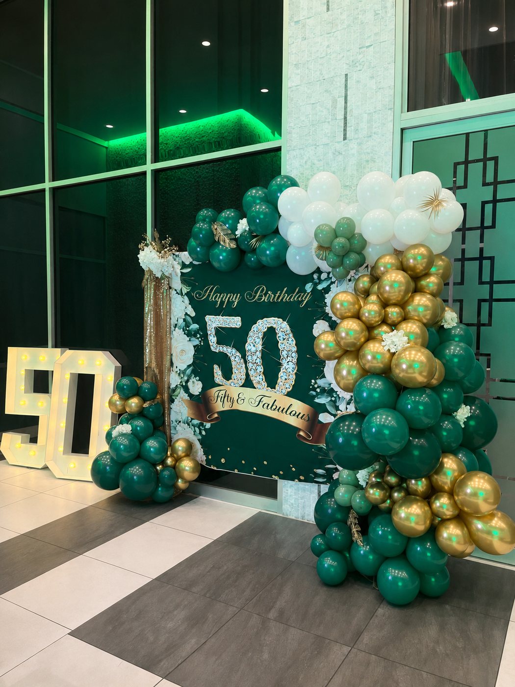 Elegant balloon and event décor setup in blush, cream, and gold